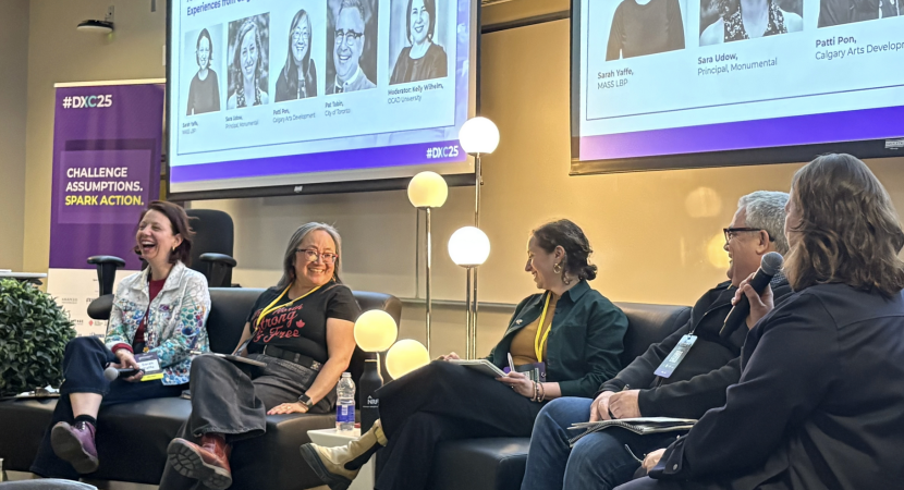 Panel of guest speakers sitting in chairs.