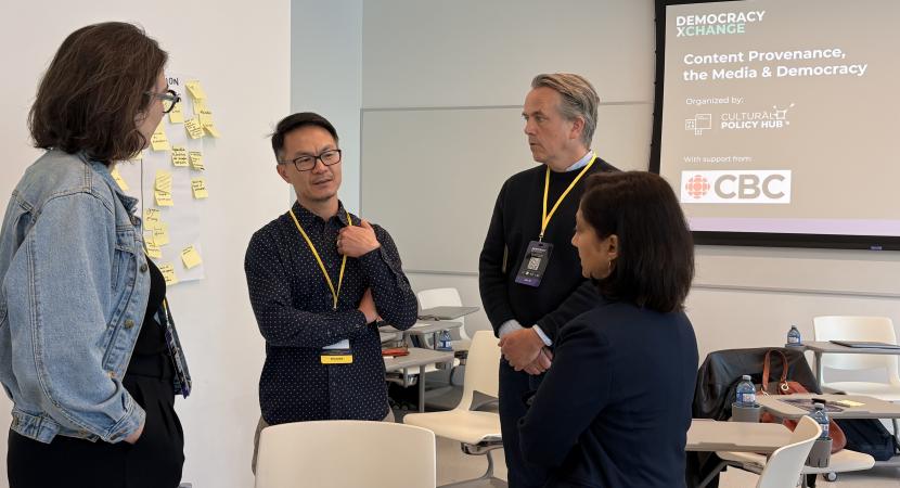 Photograph of Wilf Dinnick and Tai Huynh in discussion during the Hub’s workshop on Content Provenance, the Media, and Democracy  